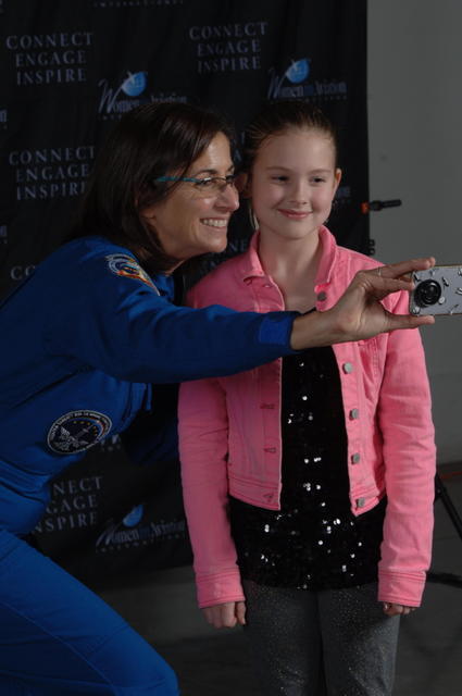 Astronaut Nicole Stott with girl taking selfie